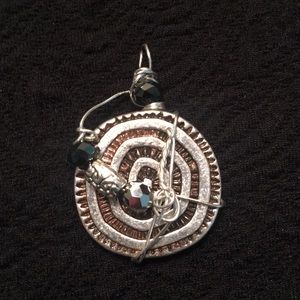 Handcrafted pendant.